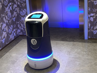 Hotel robot waiting for the elevator